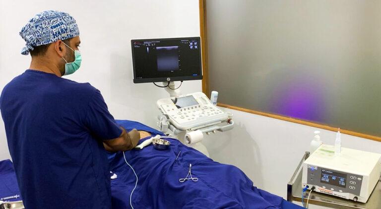 Pain management specialist performing radiofrequency ablation